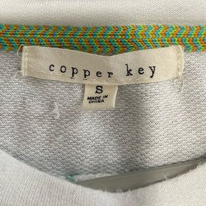 White shirt with teal threading. ONLY WORN ONCE